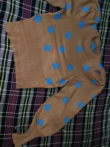 Tan color sweater top with blue dots