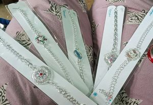 2 Elegant Silver Rakhi Set