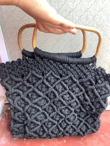 Handmade cord handbag in wooden handle