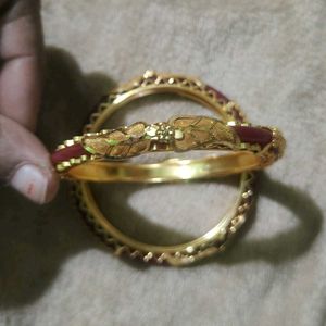 Elegant Gold Bangles with Red Accents