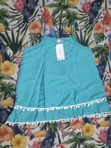 Chic Teal Top with Pom Po