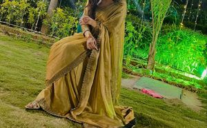 Elegant Golden Saree with Embellished Border