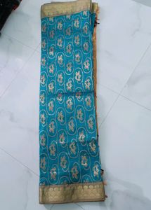Elegant Teal Saree with Gold Motif
