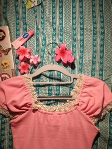 Pink lacey top with a bow