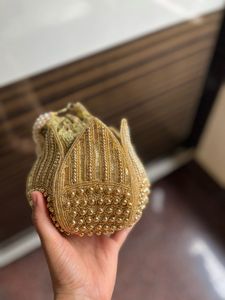 Elegant Gold Embellished Potli Bag