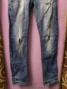 Distressed Blue Denim Jeans