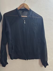 transparent black shrug top with zip