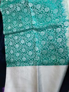 Elegant Teal Saree with Silver Floral Motifs