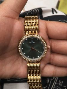 Elegant Gold Watch with Green Dial