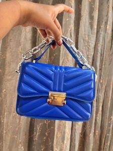 Blue sling purse