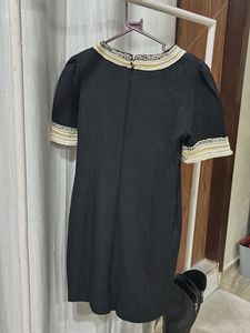 Elegant Black Dress with Embellished Neckline