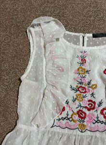 Embroidered White Peplum Top
