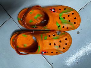 kids Orange Crocs with Green Splatter