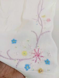 Chic White Sleeveless Top with Floral Embroidery