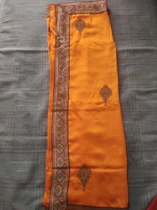 Elegant Orange Silk Saree with Embellishments