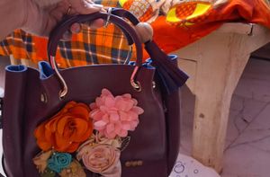 Charming Burgundy Handbag with Floral Embellishmen