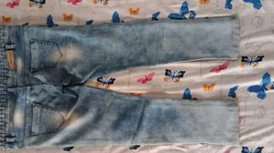 Light Wash Distressed Jeans with Unique Waistband