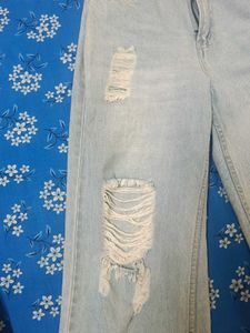 Distressed Light Wash Denim Jeans