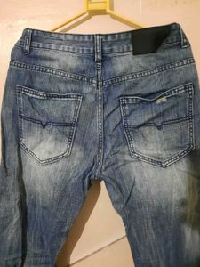 2 numbers of Distressed Blue Jeans