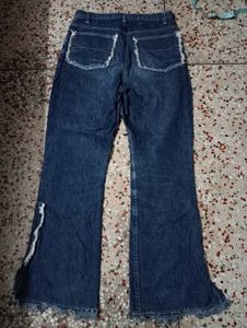 Flared Denim Jeans with Frayed Hem