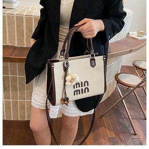 Stylish Taupe Tote Bag with Charm