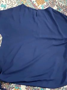 Navy blue top with knot in lower side
