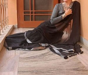 Mesmerizing Black With Silver Border And Tassels.