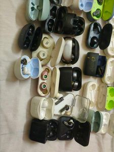 Assorted Earbud Cases and Earbuds
