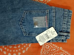 Distressed Blue Denim Jeans