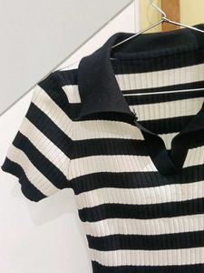 a black and white striped streetwear top. basic we