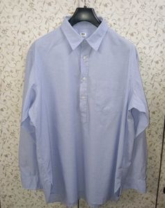 uniqlo light blue half button shirt