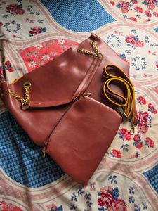 Chic Maroon Handbag with Gold Chain Accents