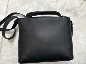 Chic Black Handbag with Chain Detail