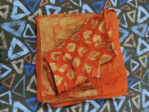 Vibrant Orange Saree with Gold Border