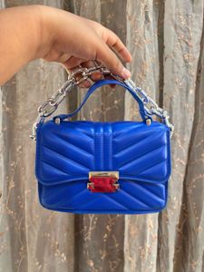 Blue sling purse