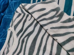 White Velvet Sweater With Black Stripes On It