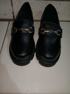 Black Loafers with Gold Detail