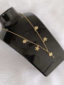 Delicate Gold Flower &amp; Key Necklace