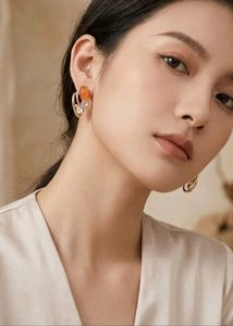 Elegant Gold Tone Earrings with Orange Stones