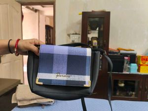 Chic Black Crossbody Bag with Striped Accent