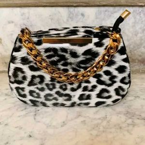 leopard print style. black and white bag