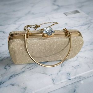 Sparkly Gold Clutch Bag with Gemstone Clasp