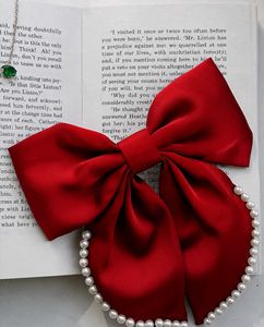 Chic Red Bow Hair Clip with Pearls