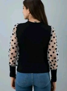 Chic Black Top with Polka Dot Sleeves