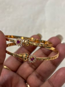 Elegant Gold Bangles with Ruby Accents