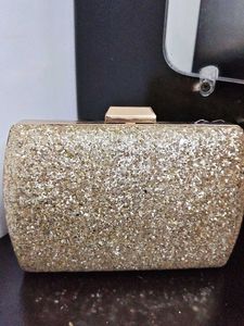 styling and charming gold clutch