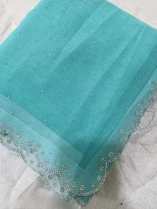 Elegant Teal Saree suitable for parties..