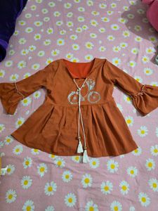 Cute Orange Peplum top with Bicycle Print