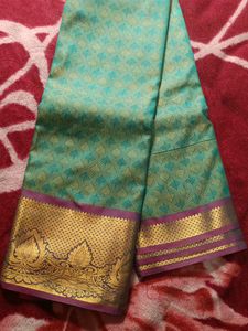 Beautiful Teal Saree with Gold Border