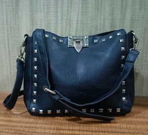 Black studded shoulder bag